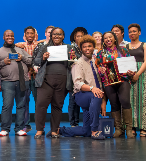 Talent show participants gather on stage